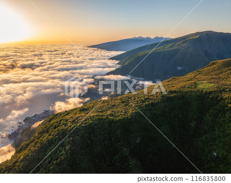 Aerial view of sunrise above clouds on Madeira island, Portugal 116835800