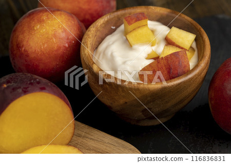 yogurt and cow's milk and nectarine slices 116836831