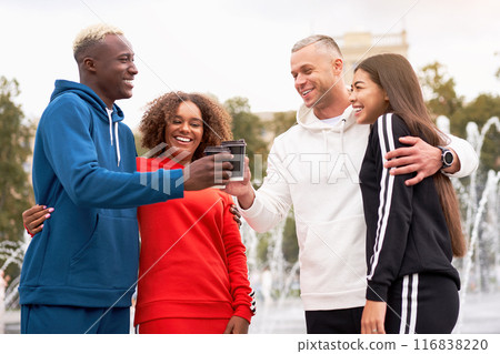 Cheerful diverse friends toasting coffee cups in Cheerful diverse friends toasting coffee cups in 116838220