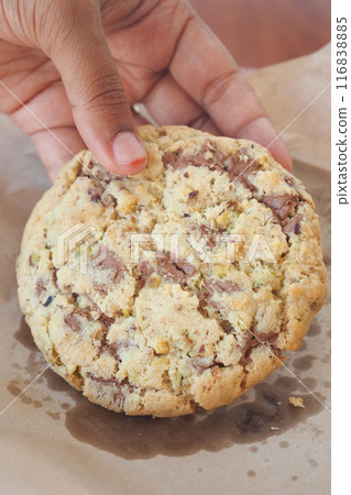 closeup of hand pick sweet cookies closeup of hand pick sweet cookies 116838885
