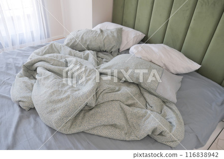 messy bed in early morning , messy bed after waking up messy bed in early morning , messy bed after waking up 116838942