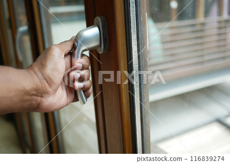 hand open gray plastic pvc window at home at early morning  116839274