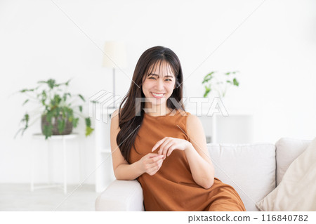 A young woman relaxing in the room 116840782