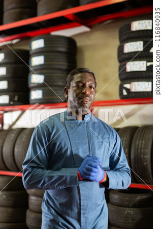Portrait of african male mechanician posing in workshop Portrait of african male mechanician posing in workshop 116840935
