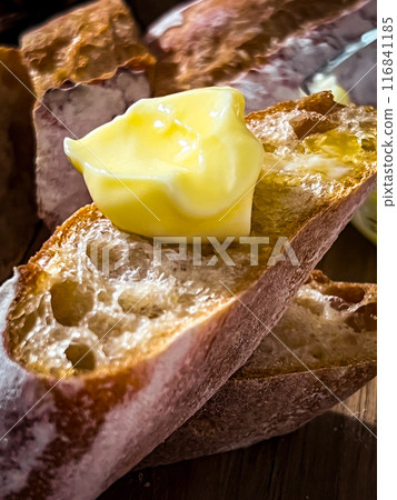 Homemade French Bread and Butter: A delicious breakfast table setting photographed in natural light 116841185