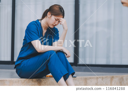 Stressed doctor sitting in front of office, working pressure. Stressed doctor sitting in front of office, working pressure. 116841288
