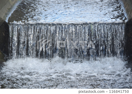 The cool flow of the irrigation canal The cool flow of the irrigation canal 116841750