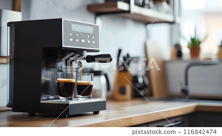 In a chic kitchen, a modern espresso machine brews two flawless cups of coffee. With its sleek design and topnotch baristalevel quality, coffee lovers can relish the experience 116842474