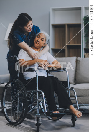 Asian physiotherapist helping elderly woman patient stretching arm during exercise correct with dumbbell in hand during training hand with patient Back problems in garden. Nursing home hospital Asian physiotherapist helping elderly woman patient stretching arm during exercise correct with dumbbell in hand during training hand with patient Back problems in garden. Nursing home hospital 116843101