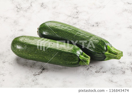 Raw green ripe zucchini vegetable 116843474