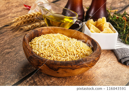 Italian raw dry pasta risoni Italian raw dry pasta risoni 116843591