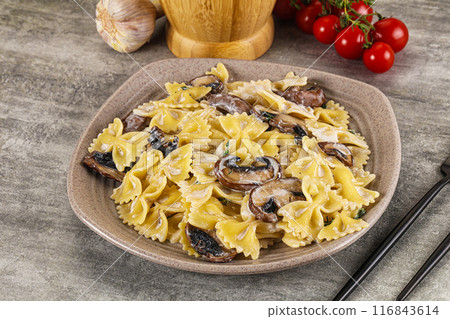 Italian cuisine - farfalle with mushrooms 116843614