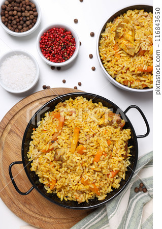 Pilaf and spices on white background, top view Pilaf and spices on white background, top view 116843650