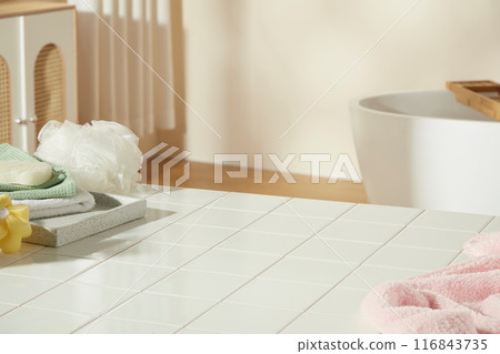 Lifestyle photography in bathroom for promotional, was shot from high angle at a white table with checkered pattern. Blank space for product showing in the center, decorated with a few bathroom stocks 116843735