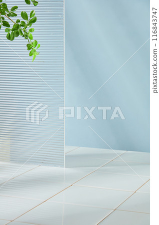 The photography of minimalist style bathroom with blue background and white brick floor. Plenty spaces for product advertisement and adding elements of designing 116843747