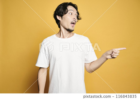 A man pointing with a colored background A man pointing with a colored background 116843835