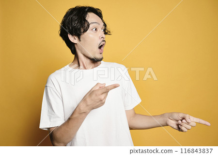 A man pointing with a colored background 116843837