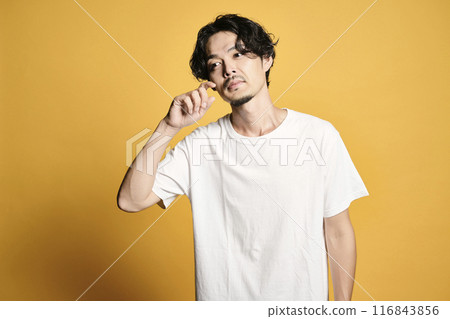 A man posing with a colored bag A man posing with a colored bag 116843856