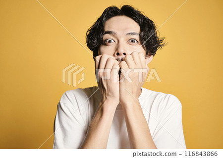 A man posing with a colored bag 116843866