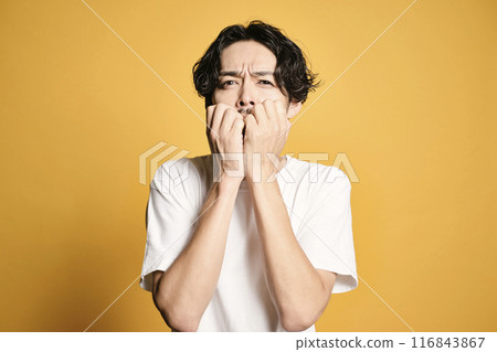 A man posing with a colored bag 116843867