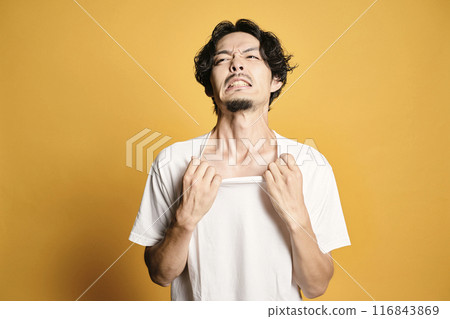 A man posing with a colored bag 116843869
