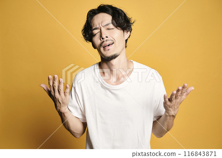 A man posing with a colored bag A man posing with a colored bag 116843871