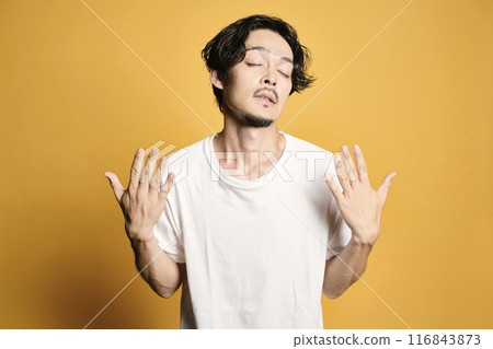 A man posing with a colored bag 116843873