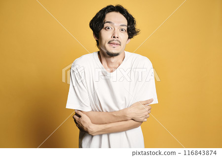 A man posing with a colored bag A man posing with a colored bag 116843874