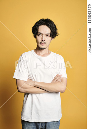 A man posing with a colored bag A man posing with a colored bag 116843879