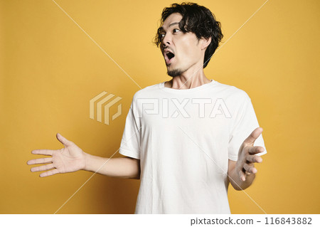 A man posing with a colored bag 116843882