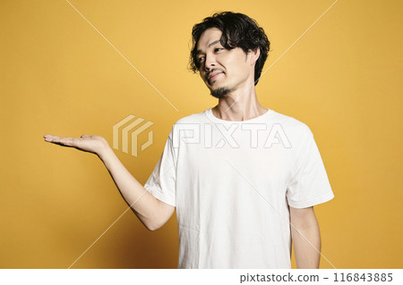A man posing with a colored bag A man posing with a colored bag 116843885