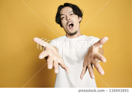 A man posing with a colored bag A man posing with a colored bag 116843891