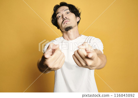 A man posing with a colored bag 116843892