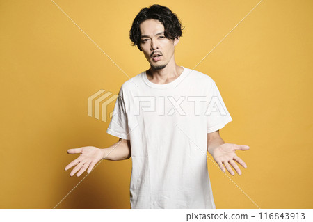 A man posing with a colored bag 116843913