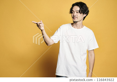 A man posing with a colored bag A man posing with a colored bag 116843922