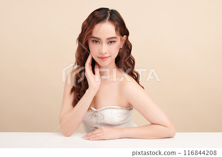 Beautiful young asian woman with clean fresh skin on beige background, Face care, Facial treatment, Cosmetology, beauty and spa, Asian women portrait. Beautiful young asian woman with clean fresh skin on beige background, Face care, Facial treatment, Cosmetology, beauty and spa, Asian women portrait. 116844208