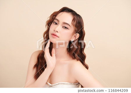 Beautiful young asian woman with clean fresh skin on beige background, Face care, Facial treatment, Cosmetology, beauty and spa, Asian women portrait. Beautiful young asian woman with clean fresh skin on beige background, Face care, Facial treatment, Cosmetology, beauty and spa, Asian women portrait. 116844209