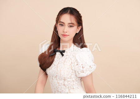Beautiful young asian woman with clean fresh skin on beige background, Face care, Facial treatment, Cosmetology, beauty and spa, Asian women portrait. 116844211