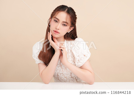 Beautiful young asian woman with clean fresh skin on beige background, Face care, Facial treatment, Cosmetology, beauty and spa, Asian women portrait. 116844218