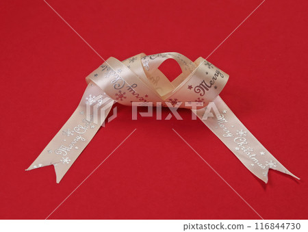 Holidays, Celebrations. Christmas white ribbon with Merry Christmas text. Template for design on red background. Holidays, Celebrations. Christmas white ribbon with Merry Christmas text. Template for design on red background. 116844730