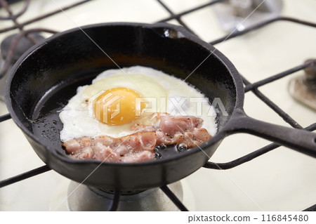 Fried eggs and bacon in a frying pan Fried eggs and bacon in a frying pan 116845480