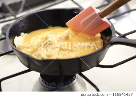 Softly fried eggs in a frying pan Scrambled eggs 116845487