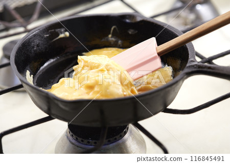 Softly fried eggs in a frying pan Scrambled eggs 116845491