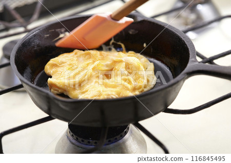 Softly fried eggs in a frying pan Scrambled eggs 116845495
