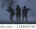 Silhouette of the fully equipped military operation moving through foggy forest with automatic assault rifle 116846596