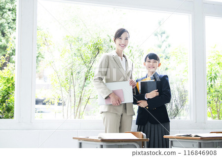Teacher and student looking at camera portrait Teacher and student looking at camera portrait 116846908