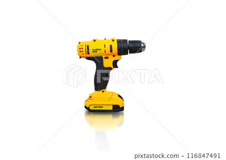 Yellow electric cordless drill isolated with battery on white background Yellow electric cordless drill isolated with battery on white background 116847491