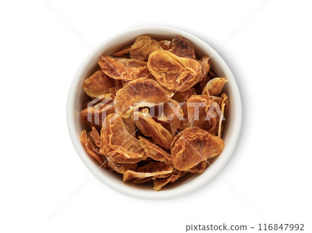 Bowl with dried sweet tangerine mandarine bites isolated on white background. Bowl with dried sweet tangerine mandarine bites isolated on white background. 116847992