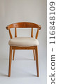 Wooden Chair with a White Cushion 116848109