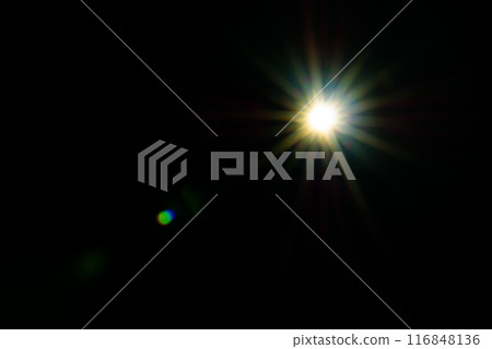 Sun flare on the black background 116848136
